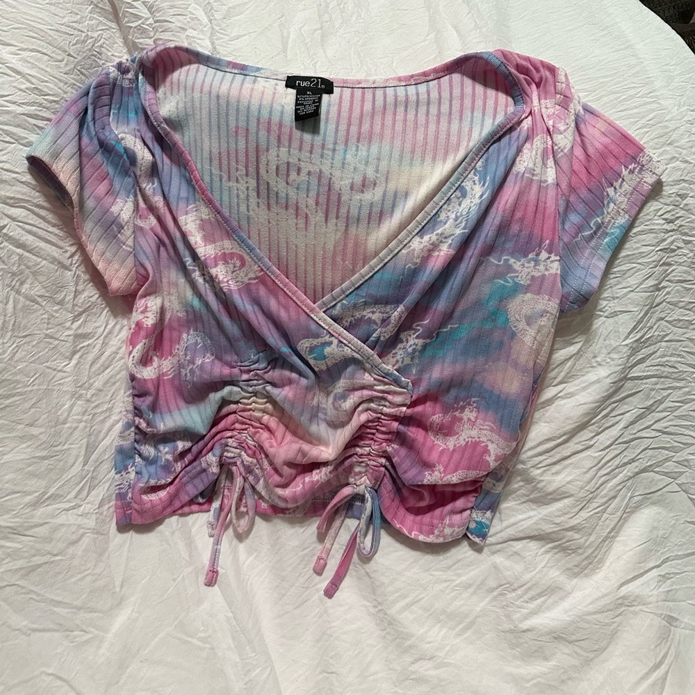 Purple and pink and blue dragon top with stretch ties on the side
